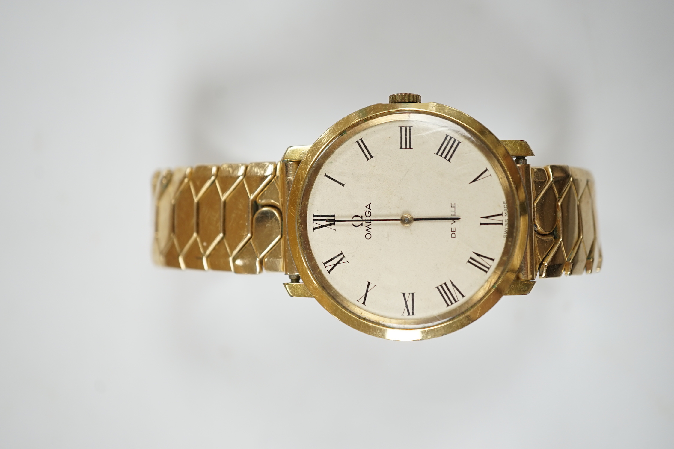 A gentleman's steel and gold plated Omega De Ville manual wind wrist watch, on associated flexible strap, case diameter 33mm, no box or papers.
